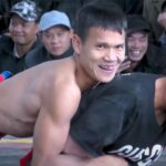 ベトナムの男女混合レスリング動画、若い女の子に抱き着き舌なめずりする男