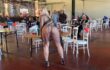 フードコートっぽい場所でほぼ全裸になってる露出狂な巨乳女性2