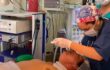 オッパイ丸出しの熟女が口腔内に何かを挿入されている動画